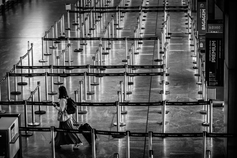 Woman walking in an empty airport
