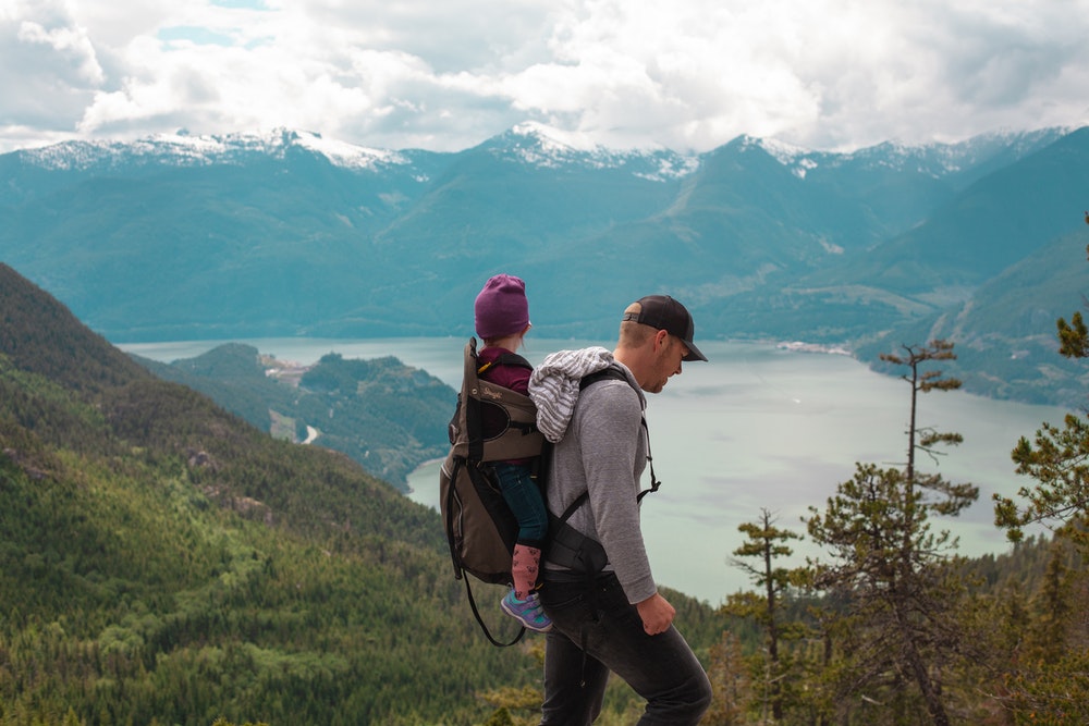 A man hiking with a kid