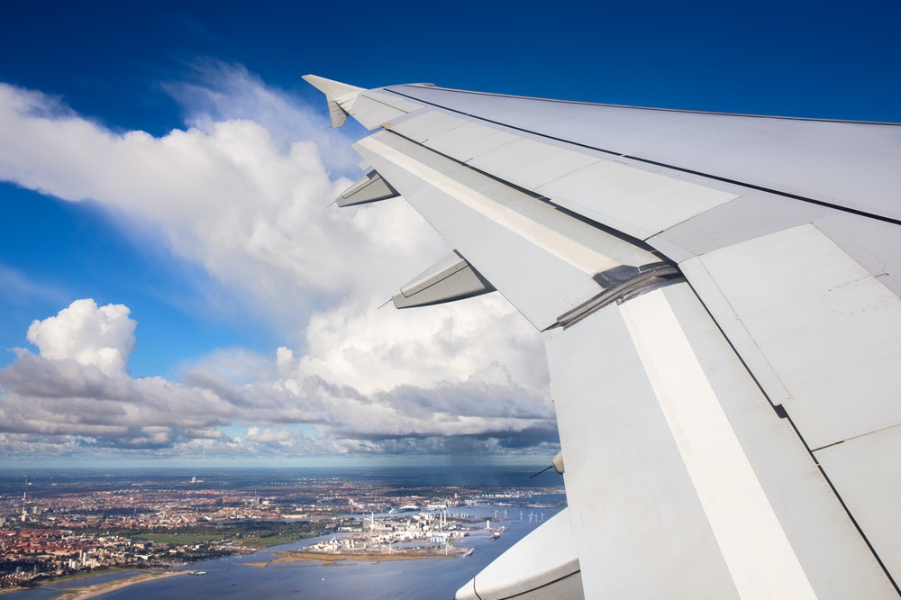 Airplane flying over a city