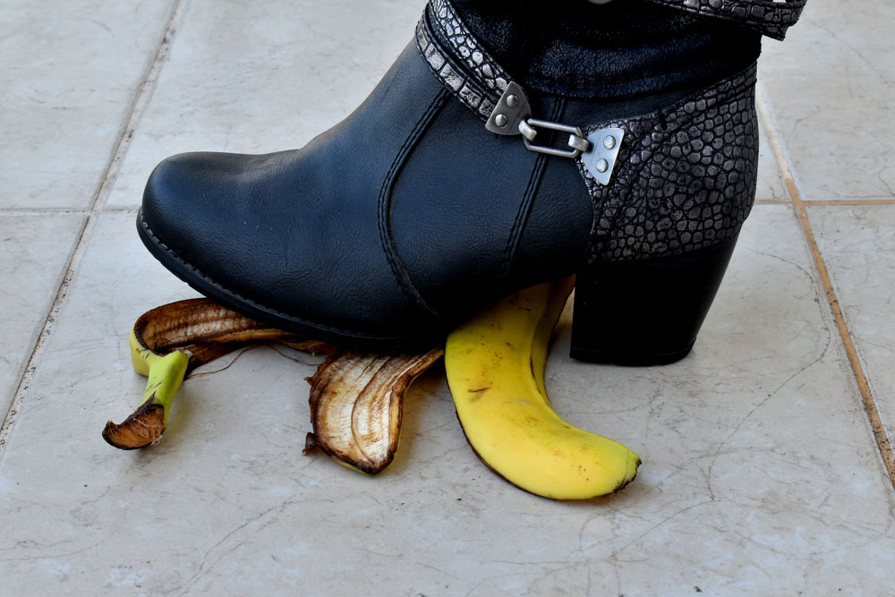 Woman stepping on banana skin