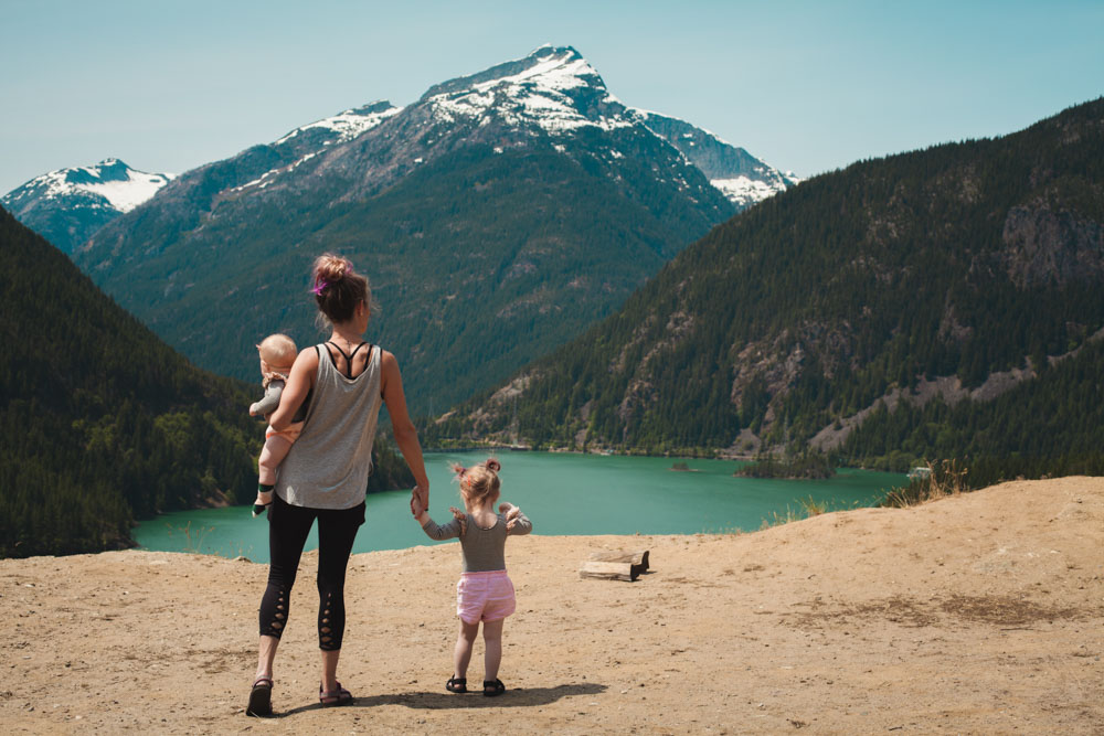 Woman with two kids in the mountains