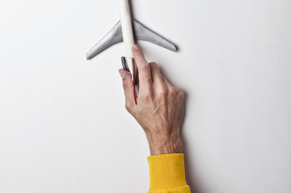 Holding a toy plane