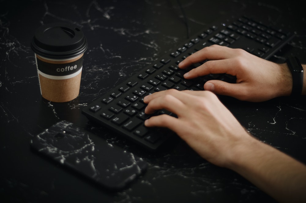 Writing on black keyboard